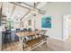 Spacious dining area with a large table, seating for six, and modern lighting at 7540 Sunshine Skyway S Ln # 217, St Petersburg, FL 33711