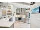 Modern kitchen with grey cabinets, stainless steel appliances, and stylish backsplash at 7540 Sunshine Skyway S Ln # 217, St Petersburg, FL 33711