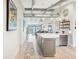 Bright, open kitchen with a large island, stainless steel appliances, and modern design at 7540 Sunshine Skyway S Ln # 217, St Petersburg, FL 33711