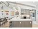 Spacious kitchen with large island, stainless steel appliances, and unique lighting fixtures at 7540 Sunshine Skyway S Ln # 217, St Petersburg, FL 33711