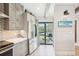 Modern kitchen featuring stainless steel appliances and balcony with a grill at 7540 Sunshine Skyway S Ln # 217, St Petersburg, FL 33711