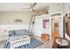 Cozy living room with a loft ladder, modern decor, and a glimpse into the bathroom at 7540 Sunshine Skyway S Ln # 217, St Petersburg, FL 33711