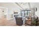 Bright living room with modern furnishings, fireplace, and sliding doors to balcony with water view at 7540 Sunshine Skyway S Ln # 217, St Petersburg, FL 33711