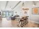 Open-concept living area with dining table, comfortable seating, and picturesque water views at 7540 Sunshine Skyway S Ln # 217, St Petersburg, FL 33711