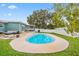 Backyard with a swimming pool, lounge area, and screened patio at 7690 91St St, Seminole, FL 33777