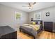 Well-lit bedroom with two windows and a ceiling fan at 7690 91St St, Seminole, FL 33777