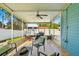 Covered patio with furniture, string lights, and ceiling fan at 7690 91St St, Seminole, FL 33777