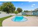 Backyard with a blue swimming pool and fenced yard at 7690 91St St, Seminole, FL 33777