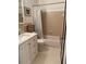 Bathroom with neutral tile, walk-in shower and a light vanity at 8320 112Th St # 206, Seminole, FL 33772