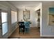 Bright dining room featuring neutral walls, wood flooring, and seating for four at 8320 112Th St # 206, Seminole, FL 33772