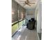 Cozy enclosed porch with comfortable seating and decor evoking a relaxing beach vibe at 8320 112Th St # 206, Seminole, FL 33772