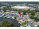 Aerial of waterfront home with backyard dock and canal access near local businesses at 8702 Driftwood Dr, Tampa, FL 33615