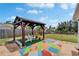 Backyard featuring pergola, seating area and view of the lake at 8702 Driftwood Dr, Tampa, FL 33615