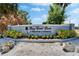 Entrance sign to Bay Crest Park, a waterfront community with lush landscaping at 8702 Driftwood Dr, Tampa, FL 33615