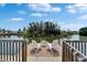 Inviting dock with two chairs, perfect for enjoying waterfront views and relaxation on the canal at 8702 Driftwood Dr, Tampa, FL 33615