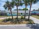 Lovely home with mature palm trees and a well-maintained lawn, creating a welcoming curb appeal at 8702 Driftwood Dr, Tampa, FL 33615
