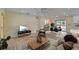 Bright and airy living room showcasing tile flooring, open floor plan, and stylish decor at 8702 Driftwood Dr, Tampa, FL 33615