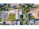 Ariel shot of a home featuring a kidney-shaped pool and beautiful backyard at 920 Palm Dr, Belleair Beach, FL 33786