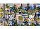 An aerial view of the home and neighborhood, showcasing the proximity to other homes and community layout at 920 Palm Dr, Belleair Beach, FL 33786