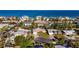 An aerial view showcases the home's location within a beachfront residential neighborhood at 920 Palm Dr, Belleair Beach, FL 33786