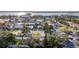 Residential neighborhood featuring diverse homes, mature trees, and well-kept lawns near the water at 920 Palm Dr, Belleair Beach, FL 33786