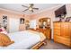 Bedroom features light pink walls, neutral carpet, and an ensuite bathroom at 9229 Dayflower Dr, Tampa, FL 33647