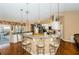 Bright kitchen features granite counters, stainless appliances, a breakfast bar with seating and pendant lighting at 9229 Dayflower Dr, Tampa, FL 33647