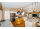 Bright kitchen with white cabinets, stainless steel appliances, and granite countertops at 9229 Dayflower Dr, Tampa, FL 33647