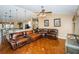 Bright living room featuring hardwood floors and neutral paint, open to kitchen and dining area at 9229 Dayflower Dr, Tampa, FL 33647