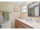 Bright bathroom featuring a vanity with storage, a marble countertop, and natural light at 9945 47Th N Ave # 208, St Petersburg, FL 33708
