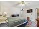 Well-lit bedroom featuring an area rug, television, and a cozy feel at 9945 47Th N Ave # 208, St Petersburg, FL 33708