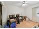 Multi-purpose room with vinyl floors, ceiling fan, and ample storage at 9945 47Th N Ave # 208, St Petersburg, FL 33708