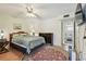 Spacious bedroom with wood floors and access to an ensuite bathroom at 9945 47Th N Ave # 208, St Petersburg, FL 33708