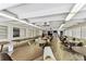 This common area is furnished with tables and chairs, creating a flexible gathering space for residents at 9945 47Th N Ave # 208, St Petersburg, FL 33708