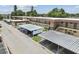 Two-story multi-Gathering property with covered parking spots and manicured landscaping at 9945 47Th N Ave # 208, St Petersburg, FL 33708