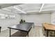 Community game room with a ping pong table, chairs, and great lighting at 9945 47Th N Ave # 208, St Petersburg, FL 33708