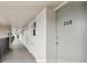 Hallway showing the entrance to unit 208 at 9945 47Th N Ave # 208, St Petersburg, FL 33708