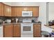 Updated kitchen featuring stainless appliances and stylish backsplash at 9945 47Th N Ave # 208, St Petersburg, FL 33708