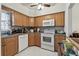 The kitchen includes stainless steel appliances and ample cabinet space at 9945 47Th N Ave # 208, St Petersburg, FL 33708