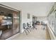 Spacious sunroom with tile flooring, filled with an assortment of seating options and natural light at 9945 47Th N Ave # 208, St Petersburg, FL 33708