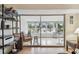 A bright sunroom featuring lots of natural light, tile flooring, and large glass windows offering beautiful views at 9945 47Th N Ave # 208, St Petersburg, FL 33708