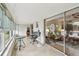 Bright patio with tile flooring, and large sliding glass doors leading into the home at 9945 47Th N Ave # 208, St Petersburg, FL 33708