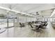 A bright recreation room with tables and chairs, next to the pool, offers a welcoming space for socializing at 9945 47Th N Ave # 208, St Petersburg, FL 33708