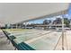 This is an outdoor shuffleboard court with benches and covered shelters, perfect for leisurely games and community fun at 9945 47Th N Ave # 208, St Petersburg, FL 33708