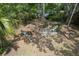 Spacious backyard with multiple seating areas and mature trees, perfect for outdoor enjoyment at 10119 Cliff Cir, Tampa, FL 33612