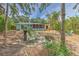 Inviting backyard with outdoor seating and screened porch, ideal for entertaining at 10119 Cliff Cir, Tampa, FL 33612