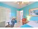 Bedroom featuring blue walls, ceiling fan and tile flooring at 10119 Cliff Cir, Tampa, FL 33612
