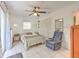 Cozy bedroom featuring tiled flooring, ample closet space, and soft natural light creating a relaxing ambiance at 10119 Cliff Cir, Tampa, FL 33612