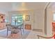 Cozy dining room features a decorative rug, tile flooring, and a large window with natural light at 10119 Cliff Cir, Tampa, FL 33612