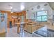 Bright kitchen showcasing white cabinetry, breakfast bar, and ample natural light highlighting the cooking space at 10119 Cliff Cir, Tampa, FL 33612